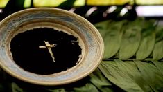 a cross is in the center of a bowl