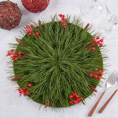 the table is set with red and green decorations