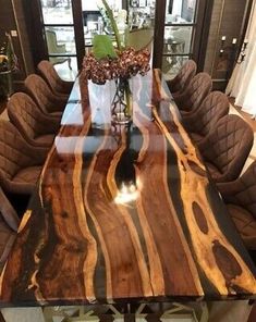 a wooden table with chairs around it