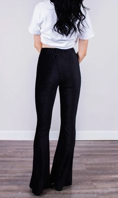 Fitted black high-rise corduroy pant with a bell bottom silhouette. Fits true to size. Flared Velvet Bottoms, Stretch Velvet Flare Bottoms, Stretch Flare Corduroy Bottoms, Stretch Corduroy Flare Bottoms, Black Velvet Bottoms For Night Out, Black Corduroy Bottoms For Fall, Fitted Black Corduroy Pants, Black Stretch Velvet Pants, Black Fitted Velvet Pants