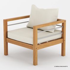 a wooden chair with white cushions on it