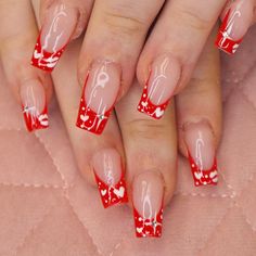 Turn your nails into a winter wonderland with long coffin red nails. Our blog post is filled with ideas to adorn your nails this season. From French tips to Christmas motifs, these designs are perfect for those who love to make a statement with their nail length and style. Red French Tip Coffin