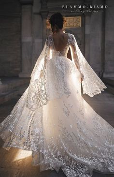 the back of a wedding dress with long sleeves