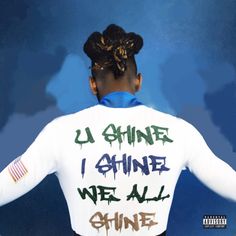 the back of a woman's shirt that says, la chine i shine we all shine