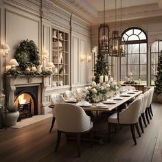 a dining room table set with white chairs and place settings for eight people, in front of a fireplace