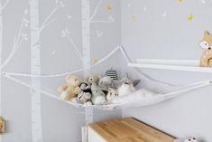 there are stuffed animals in the hammock hanging from the tree branch wallpaper