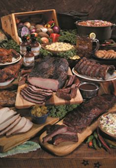 a table full of meats and other food items