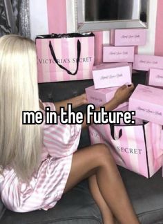 a woman sitting on top of a couch next to pink bags with the words me in the future