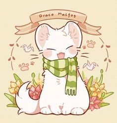 a white cat with a green scarf around its neck