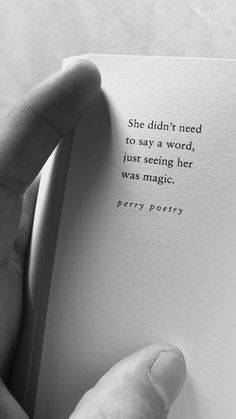 a person holding an open book with the words she didn't need to say a word, just seeing her was magic