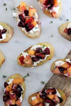 small appetizers with fruit and cheese on them