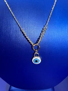 18k yellow gold chain with white evil eye pendant.  You can mix it with another necklaces as shown in picture.  Necklaces are sold separately Beautiful Baby Pictures, Baby Elf Hat, Newborn Knit Hat, Evil Eye Necklace Gold, Newborn Christmas, Red Baby, Elf Hat, Baby Christmas Gifts, Evil Eye Pendant