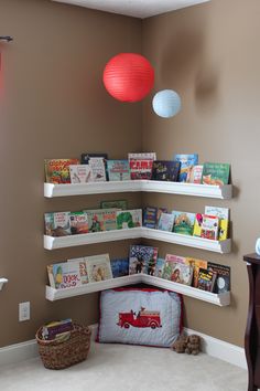 a child's room with bookshelves and toys on the shelves in it