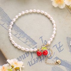 Transform your look with our stunning Cherry Pearl Anklet! Made with high-quality cherry pearls, this anklet adds a touch of elegance and sophistication to any outfit. Elevate your style and feel confident and beautiful with this must-have accessory. Details Plating: 18K Gold Materials: 18K Gold on Brass, Enamel, Freshwater Pearls Size: 6.5"(165mm) Weight: 11.6g Elegant Pearl Beaded Anklets, Elegant Spring Anklets For Gift, Elegant Spring Anklets For Gifts, Elegant Spring Anklets As Gifts, Elegant Pearl Anklets As Gift, Elegant Red Anklets For Gift, Elegant Adjustable Pearl Bracelet For Spring, Elegant Summer Anklets With Round Beads, Elegant Pearl Bracelet With Round Beads For Summer