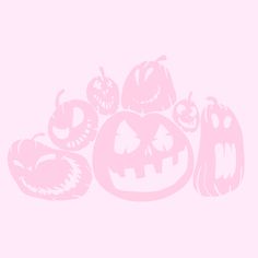 halloween pumpkins and jack - o'- lanterns on pink background