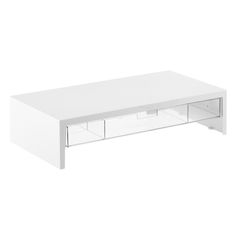 a white coffee table with drawers underneath it