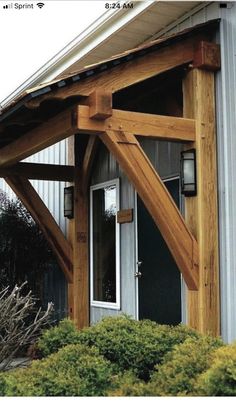 Pin by Teresa Smith on My Nest in 2022House awningsHome exterior makeoverTimber frame porch Exterior Overhang Ideas, Exterior Shudder Ideas, Wood Awnings Over Doors, Door Awnings Exterior Diy Wood, Farmhouse Awnings Over Windows Exterior, Entryway Overhang, Wood Awning Over Door, Front Porch Overhang Ideas, Gables On House Exterior