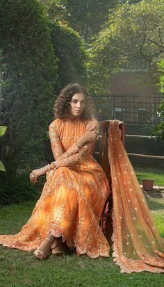 Elegant Pakistani Frock Dress in Orange Shade is a meticulously made Pakistani Fancy Dress. This dress comes with intricate details and luxurious embellishments on it making this attire a very royal pick if you are looking for Pakistani Wedding Party Dresses. Frock: This Pakistani Frock Dress comes in premium quality organza fabric. This Pakistani Dress is emblazoned with beautiful embroidery and lavish embellishments on the front and paeti making this Pakistani Long Dress look heavenly. Further Orange Pink Pakistani Dress, Pink Pakistani Dress, Pakistani Long Dresses, Pakistani Frocks, Maxi Design, Pakistani Party Wear, Dress Name, Fancy Frocks, Fancy Gowns