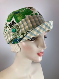 This retro baseball style vintage fabric newsboy cap is a standout! The floral print is so 1960s! The white/ivory background features flowers in greens and blues. It is embellished with a coordinating plaid band and is all topped off with a vintage flour sack yo-yo and vintage green button. The hat is fully lined with a pretty cotton fabric and an adjustable inner grosgrain ribbon helps the hat keep its shape and keep it free from makeup. This baseball/newsboy shape is deeper than a traditional Retro Curved Brim Baseball Cap For Spring, Retro Spring Baseball Cap With Curved Brim, Vintage Baseball Cap For Spring, Vintage Baseball Visor Cap For Spring, Vintage Visor Baseball Cap For Spring, Retro Visor Baseball Cap For Spring, Vintage Brimmed Baseball Cap For Summer, Retro Visor Hats For Spring, Green Flat Cap For Summer