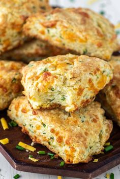 cheddar and chive scones stacked on top of each other with text overlay