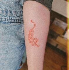 Red tiger tatto on forearm Tiger Tattoo Red Ink, Tiger Tattoo Small Simple, Micro Tiger Tattoo, Red Cheetah Tattoo, Delicate Tiger Tattoo, Red Ink Tiger Tattoo, Fineline Tiger Tattoo, Tiger Tattoo Hand, Minimal Tiger Tattoo