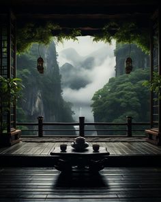 an empty room with mountains in the background and lanterns hanging from the ceiling above it