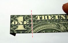 a hand holding a one dollar bill with an arrow pointing up at the other side