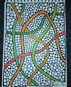 an image of a painting on paper with circles and lines in green, orange and yellow