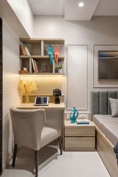 a bedroom with a bed, desk and chair next to a book shelf filled with books