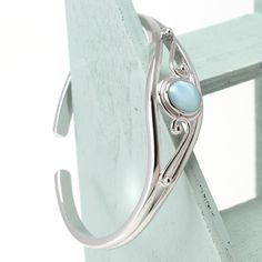 "Material:100% 925 Sterling Silver with White Gold Plated Main stone:Larimar Gemstone Other stone:N/A Size:2.32\" x 1.85\" Condition:New Main color:Blue Quantity:1 Pcs This bracelet is made with 100% natural genuine rare Larimar stone from Dominican Republic and solid 925 sterling silver w/ Rhodium gold plating for better quality and prolonged shine! Please check my other beautiful silver jewelry: www.etsy.com/shop/Chainstones A lab grown gem is a man-made material with essentially the same chem Silver Larimar Bracelets As Gift, Larimar Bracelet Jewelry Gift, Elegant Turquoise Larimar Bracelets, Elegant Larimar Cabochon Jewelry, Elegant Turquoise Larimar Jewelry, Elegant Round Larimar Jewelry, Elegant Larimar Bracelet Jewelry, Elegant Turquoise Gemstone Sterling Silver Bracelet, Elegant Turquoise Sterling Silver Oyster Bracelet