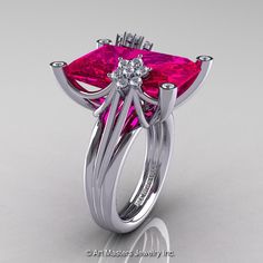 Amazing, elegant and classy, the new Modern Bridal 10K White Gold Radiant Cut 15.0 Ct Pigeon Blood Ruby Diamond Fantasy Cocktail Ring R292-10KWGDPBR the most discriminating feminine taste. High profile, flashy and tastefully designed for your lovely occasion, this luxurious rings are a sight to behold!   From the top of the band 4 imposing prongs arch up into a cradle holding a rectangular pigeon blood ruby. The solitaire stone with radiant-cut facets measures approximately 18 x 13 mm. The face of each prong exhibits a round bezel set stone adding dimension and luminosity. Originating from each shoulder a stems rise to the top of the center stone. Between the 2 stems, 2 star-flower like cluster form wavy arcs over the stone crown, imparting an element of softness and visual comfort.   Incl Art Masters Jewelry, Beautiful Diamond Rings, Ruby Engagement Ring, Modern Bridal, Ruby Jewelry, Radiant Cut, I Love Jewelry, Ruby Diamond, Pink Diamond