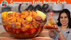 a woman holding a bag of food next to a bowl filled with shrimp and corn