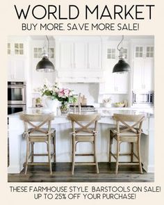 an image of a kitchen with white cabinets and wooden chairs in the center island area