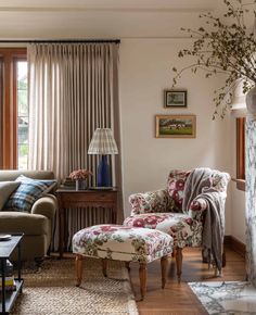 a living room filled with furniture and a fire place