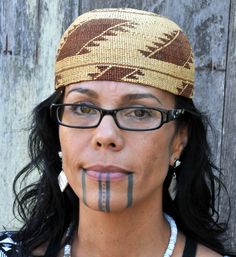 a woman with her face painted brown and black