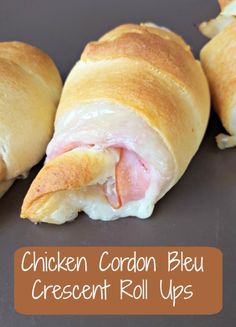 chicken cordon bleu crescent roll ups with cheese and ham on top, ready to be eaten