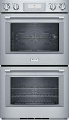 two ovens side by side with the doors open