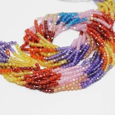 multicolored beaded bracelets on white background