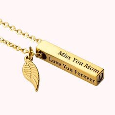 a gold plated necklace with an angel wing charm on it that says, miss you mom love you forever