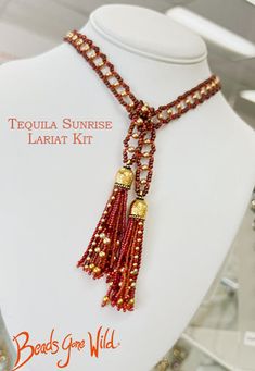 Bold colors of Oranges and Reds, Golds and Topaz make this statement lariat. The end of each lariat is embellished with a beautiful tassel with a golden cap. The Kit makes up to a 40 inch lariat from end to end. Additional length can be ordered. The tassels also can be turned into earrings if you like. Made with Czech Pearls, Japanese Seed Beads, and Plated Lead Free Pewter. The kit comes with everything you need including needles,thread, and step by step instructions. You will only have to prov Adjustable Lariat Beaded Necklaces With Tassels, Beaded Lariat Tassel Necklace, Adjustable Lariat Necklace With Tassels, Lariat Beaded Necklace With Tassels For Gift, Gift Lariat Beaded Necklace With Tassels, Tequila Sunrise, Bead Kits, Needle And Thread, Step By Step Instructions