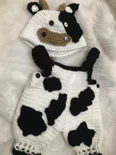 a crocheted cow hat and diaper cover