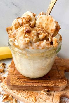 a dessert in a glass bowl on top of a cutting board