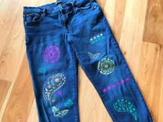 Women's size 14/32 Gap denim capris, upcycled with painted paisley, flower, and butterfly design on front and back.  This is a nice pair of longer capris pants that can be rolled up if desired.  They have been painted with paisley type designs in yellow coral, pink and green. DETAILS: Size:  14/32 girlfriend style Brand:  Gap Materials:  99% cotton, 1% spandex MEASUREMENTS: Waist:  34 inches Hips:  41 inches Inseam:  26-1/2 inches Front Rise:  11 inches Back Rise:  15-1/2 inches Circumference bottom of leg:  14 inches Be sure to check the size and measurements.  Sizing for clothing brands is often different! Hint:  To be sure this item will fit, lay your favorite pants/jeans out flat and take measurements of the same areas listed above. These are upcycled jeans, meaning previously owned/pr Bohemian Summer Festival Jeans, Bohemian Jeans For Summer Festivals, Summer Bohemian Festival Jeans, Bohemian Non-stretch Jeans For Summer, Bohemian Relaxed Fit Jeans For Spring, Relaxed Fit Jeans For Summer Festival, Non-stretch Bohemian Jeans For Summer, Bohemian Stretch Jeans For Spring, Relaxed Fit Jeans For Spring Festival