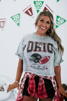 Embrace vintage charm with the Ohio Vintage Crop Tee in Grey, a stylish and nostalgic choice that effortlessly adds a touch of retro flair to your outfits, perfect for expressing your state pride. Vintage wash crop tee Ohio football Grey acid wash 100% Cotton Imported Fit: Stretchy fabrication, standard fitCropped hem Model Specs: Karli is wearing a size small in the photo.How will this item fit you? Check out our MODEL SPECS (Typical Sizing - Karli: S-Size 5/26 - 5ft 2in, Emily: S-Size 3/25 - 5 Ohio T Shirts, Kristin Juszczyk, Ohio State Outfit, Ohio Football, Vip Group, Everyday Chic, Gameday Outfit, Football Game, Clothes Ideas