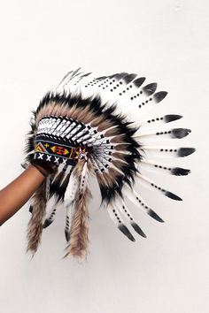 Indian style headdress, short length, native american inspired Handmade with feathers, suede fabric, and beads Hat circumference 59 cm approx, 23,2 inches approx Band: The geometric patterns of the decorative band made with beads on the front of the headdress may have some variations depending on what we have in stock at the time of the production of the headdress.Either way, the final decorative effect will be the same Please note that our products are handmade with some natural materials. For Indian Headress, Native American Headdress, Feather Headpiece, Indian Headdress, Beaded Hat, Feather Headdress, The Used, Feather Art, Indian Head