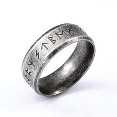 a silver ring with an inscription on it