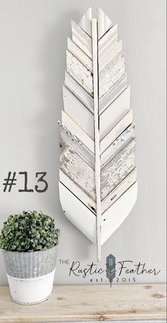 a white planter sitting on top of a wooden shelf