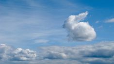 the sky is filled with white fluffy clouds