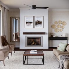 a living room filled with furniture and a fire place