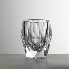 a crystal vase sitting on top of a white surface